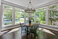 Formal dining room with floor to ceiling windows