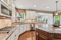 This kitchen is every cook's dream!  The gas cooktop, built-in double oven, stainless appliances and the abundance of cabinetry make this kitchen a 10!