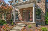 This beautiful home features an inviting front porch.