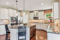 With a kitchen like this, you can host gatherings and have plenty of space!  The walk-in pantry is to the right of the refrigerator.