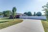 Ample parking for guests on this concrete driveway and parking pad.