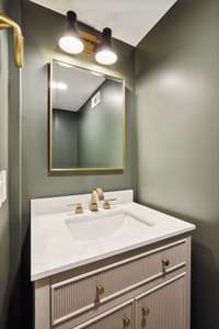 1/2 bath conveniently located to keep guests out of your master bathroom.