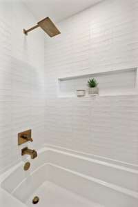 Beautiful tile shower/tub combo.