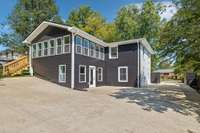 Rear view with plenty of parking space for friends and family (a hot commodity in East Nashville)