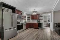 NICELY UPDATED KITCHEN WITH NEW CABINETS & SS APPLIANCES