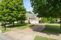 Side entry, expanded 3 car garage and plenty of driveway space for parking.