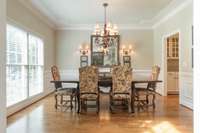 Dining room with custom trim details.