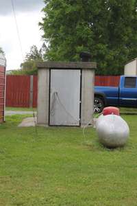 Storm Shelter behind Home