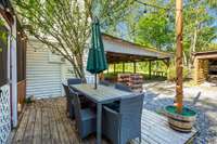 Adjacent to the screened-in patio, you'll find a separate deck, ideal for outdoor lounging, dining, or entertaining.