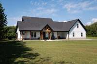 Over 1200 sq ft of tongue and groove covered porch (front and back).