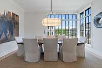 Incredible dining room with large windows and upgraded lighting