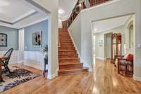 Another view of the front entry shows the formal dining room on the left~Crown molding throughout~9ft ceilings on first floor.