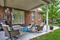 Covered back patio has surround sound~Patio is fully extended the length of the house.