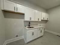 Family Ready Room offers space for the washer/dryer but also a second refrigerator. This room is located close to the garage and Kitchen.