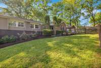 Front yard has a fenced in area with a patio and acess off the kitchen. The outdoor living area of this proterty has so much to offer!