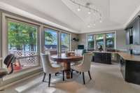 Office area off living room with oversized windows and built-in desks. Lake and waterfront views are everywhere you look.