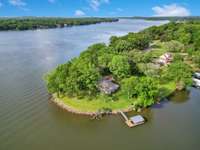 A rare find on this waterway to have a lake front home on a peninsula with easy direct acess to the water.