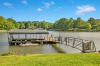 Private covered boat dock located in deep water and in the protection of a cove.