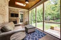 Screened back porch overlooking the back yard and woods