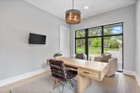 Office/bedroom with custom bookcases and walk-in closet.