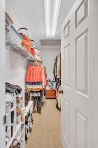 Large walk-in closet located in master bathroom