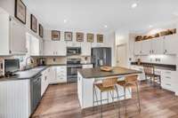 Beautifully updated kitchen cabinets with oversized desk area