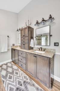 Custom double vanity with extra storage, beautiful mirrors and lighting