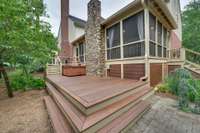 Additional decking leading to stone patio