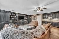 Custom wet bar with built-in refrigerator and trash can