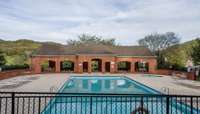 Community pool with covered pavilion along with two restrooms