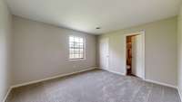 Secondary bedroom with access to the bathroom shared with the primary.