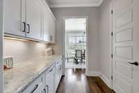 A butler's pantry connects the dining room to the kitchen and offers additional cabinets and counter space.