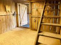 Tack room, stairs to loft