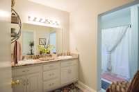 Lovely full bath, double vanities, shower/tub combo