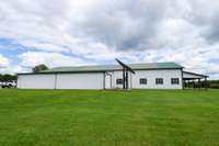 Side view of barndominium, home powered by solar panels