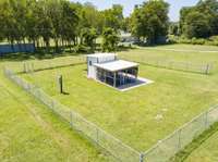 Enclosed 2 pen dog kennel with A/C and water