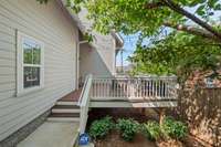 A view from the back gate to the main level patio and door. This is where the owners suggest entering the home for ease and convenience