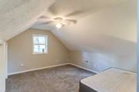 Second bedroom with carpet, closet and ceiling fan.