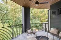 The covered balcony offers composite flooring and electrical hookups for outdoor entertainment.