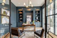 Private Study with full wall built-ins, 10' iron doors with side lites and a floor to ceiling window over looking the lush landscaping.