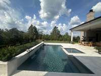 Sparkling Pool / Spa and terrace with private backyard.