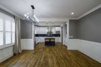 view of the large dining room leading to the kitchen.