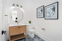 This powder room is located in the lower-level recreation area.