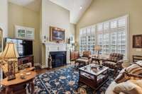 Family room with large windows viewing courtyard