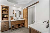 Primary Bathroom has double Restoration Hardware Vanities, plus a matching RH linen tower.