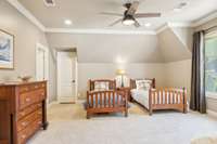 This very large front bedroom is large enough for double beds AND a daybed (see next photo).  The door at the far end leads to an additional partially finished area w/dormered window that could be a great craft room, study nook, or play area.