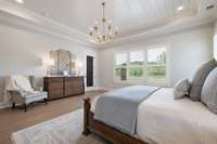 Custom plantation shutters in the primary suite & a door leading to the covered back porch