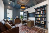 Office/Study on the main level with a coffered ceiling & custom lighting is a perfect spot for a home office.