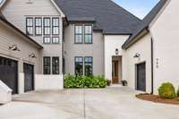 Circular driveway provides ample parking and notice the 3 car garage!