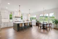 Light bright kitchen looks out to common area and Stephens Valley walking trail